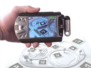promotional image for the Invisible Train augmented reality project by Daniel Wagner, Thomas Pintaric and Dieter Schmalstieg