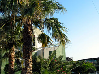 Behind the main stage, by the pool.