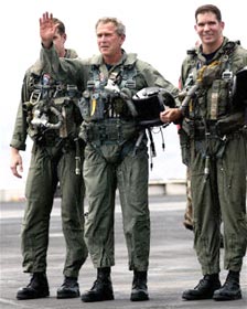 The famous 'mission accomplished' photo of President GW Bush in an Air Force flight suit.